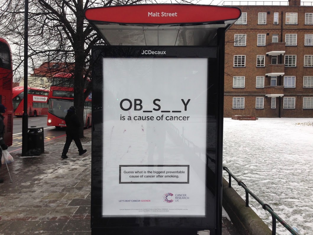 An image of a Cancer Research UK campaign advertisement seen in Peckham, London bus stop.