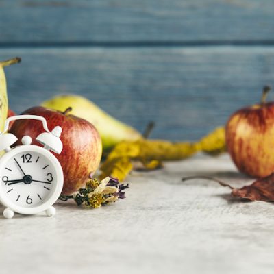 Clock with fruit.