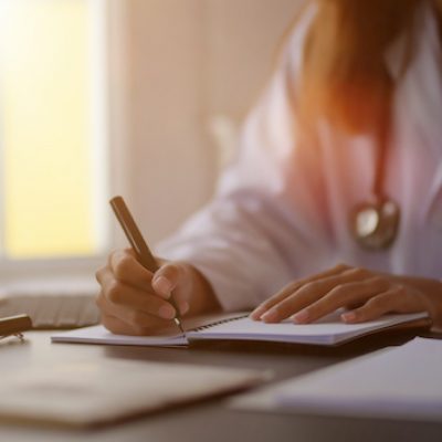 Medical student at desk.