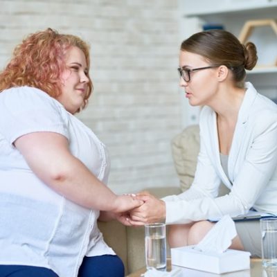 Patient with obesity consulting with doctor