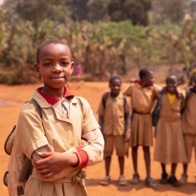 African child standing with friends