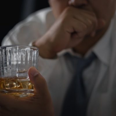 Man having an alcoholic drink.