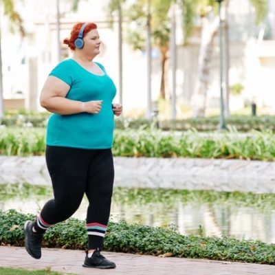Woman with obesity jogging