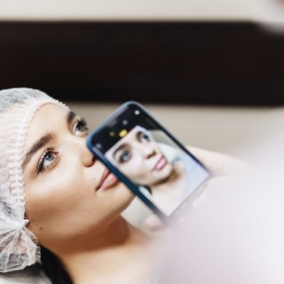 Woman receiving skin care.