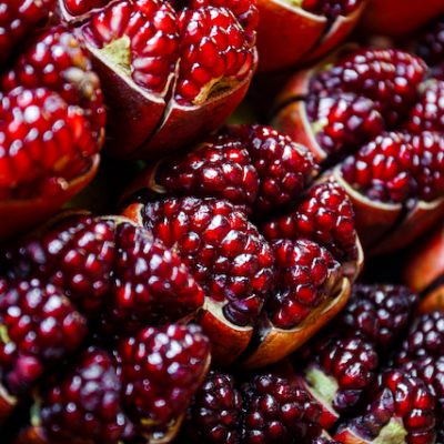 Close-up of a sliced open red pomegranate.