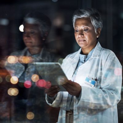 Doctor looking at tablet