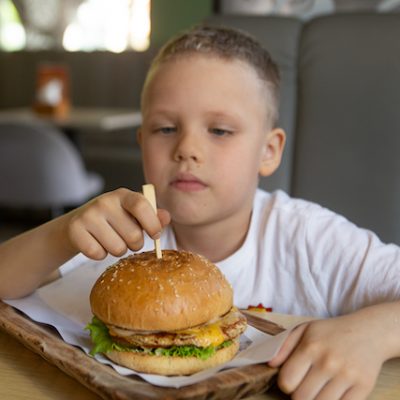 Child with sandwich.
