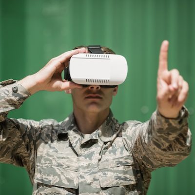 Military soldier using virtual reality headset.