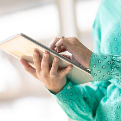 Woman using tablet computer.