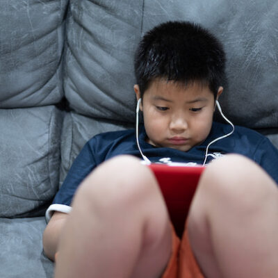 Child using tablet computer.