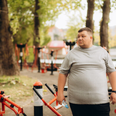Man with obesity exercising.