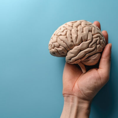A man holding a brain concept image.