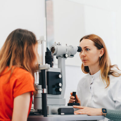 Doctor giving a patient an eye exam.