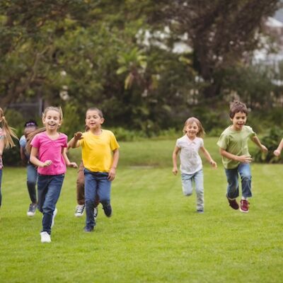 Children playing on a lawn.