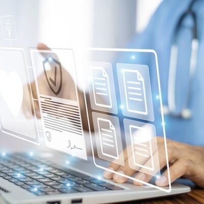 Doctor using innovative interface on a laptop.