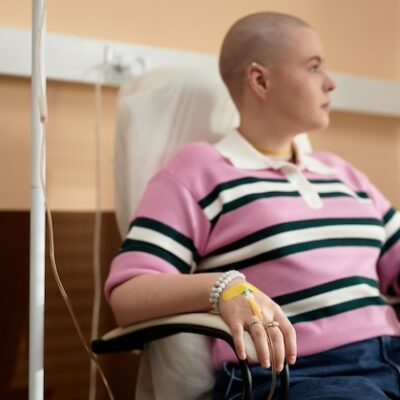 Woman with cancer receiving chemotherapy.