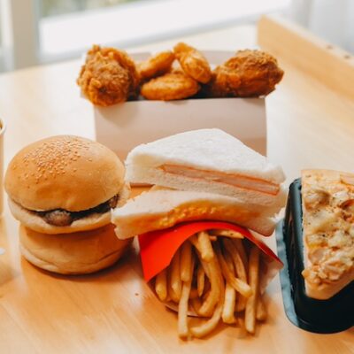 Closeup of home made burgers on a wooden table.
