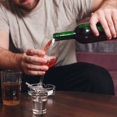 Man drinking wine at home.