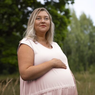 Portrait of a pregnant woman with obesity.