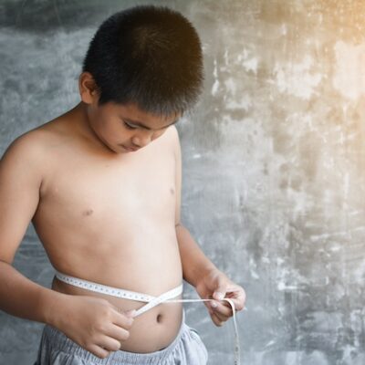 Boy with a measuring tape.