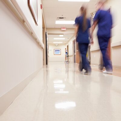 Busy hospital corridor with medical staff.
