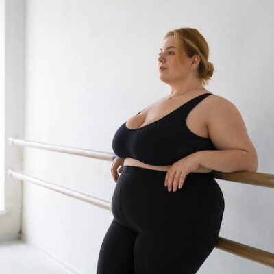 Woman with obesity at an exercise studio.
