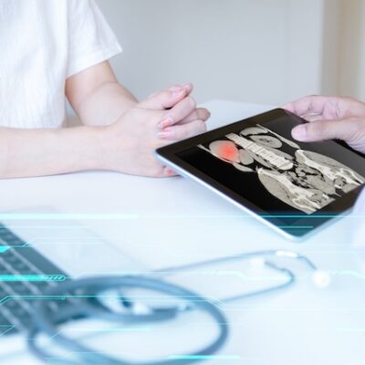 Doctor holding a tablet.