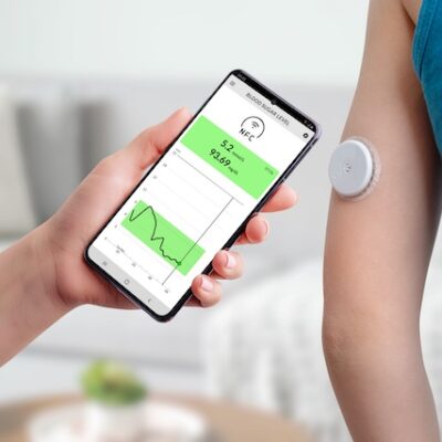 Blood glucose monitor and smartphone.