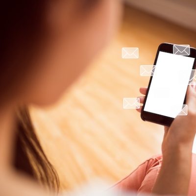 Person using a mobile phone to text message.
