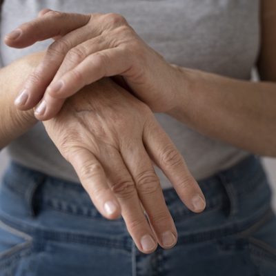 Woman rubbing her wrist.
