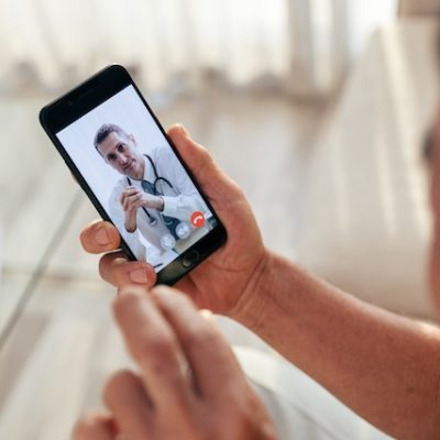 Patient meets with doctor virtually over a smartphone.