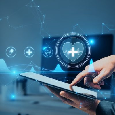 Close up of hand pointing at a tablet.