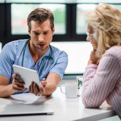 Doctor speaking with a patient.