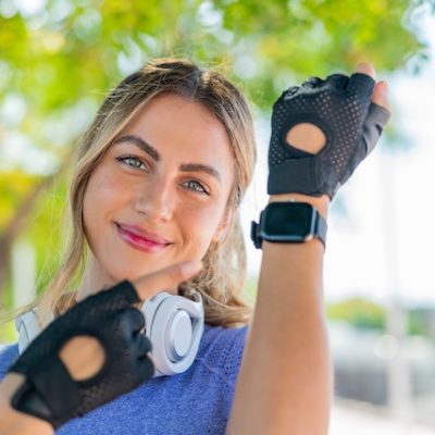 Pretty young woman wearing a smartwatch.