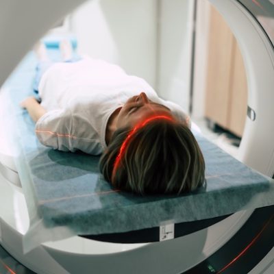 Young woman patient is ready for a CT scan.