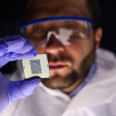 Worker making diagnostics of chip.