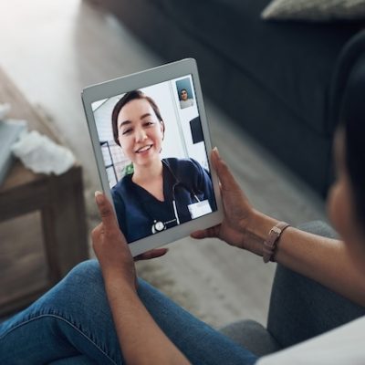 Patient consulting medical professional online virtually.
