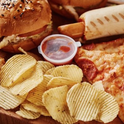 Unhealthy and junk food at a table.