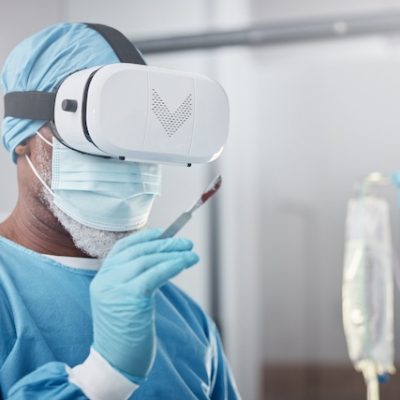 Doctor using technology in order to perform surgery remotely.