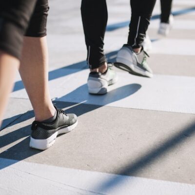 People walking in the sunlight.