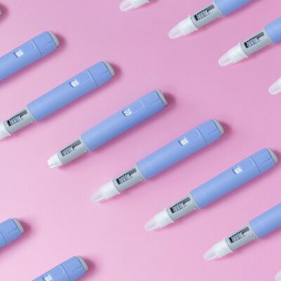 Ozpemic pens on a pink background.