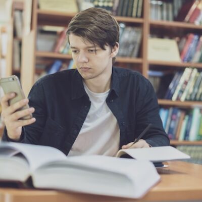 Student using phone.