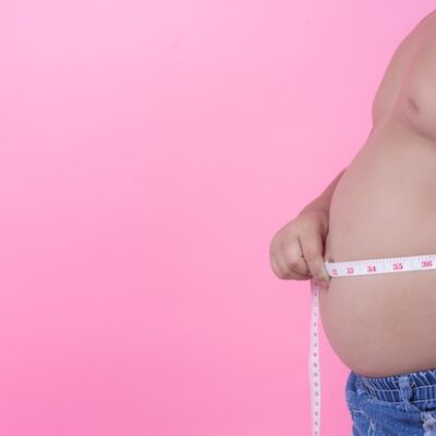 Man with a belly and a measuring tape.