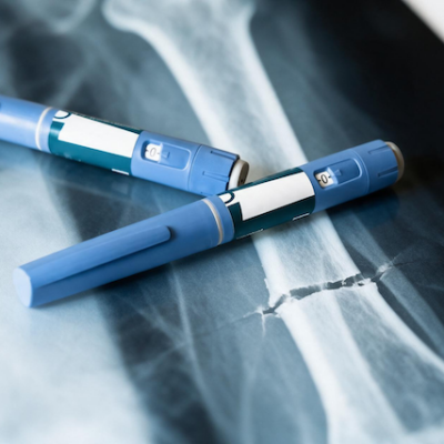 Ozempic pens on top of an x-ray.
