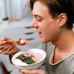 Man tasting food.
