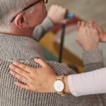 Social worker caring for senior patient with dementia.
