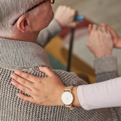 Social worker caring for senior patient with dementia.