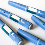A spread of Ozempic pens on a white background.