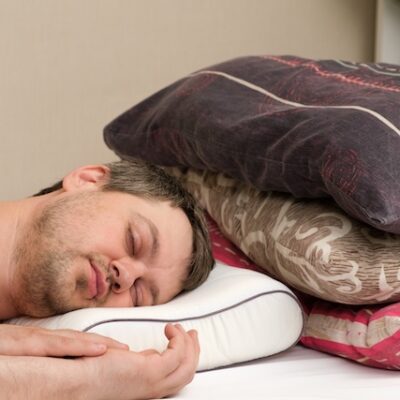 A man sleeps on an orthopedic pillow.